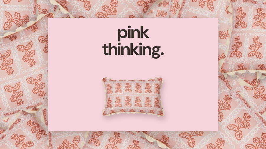 Reel cover example: a pink cushion styled on a patterned textile